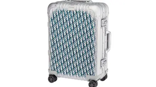 Dior și RIMOWA relansează valiza lor emblematică din aluminiu